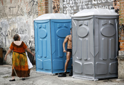 Go Go Boy - dancer changing clothes during street carnival.