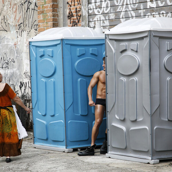 Go Go Boy - dancer changing clothes during street carnival.